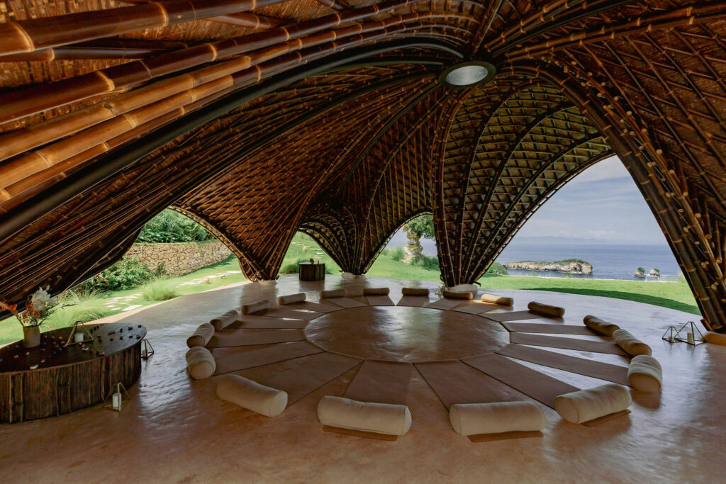 Interior of a bamboo yoga shala at a luxury retreat in Bali.
