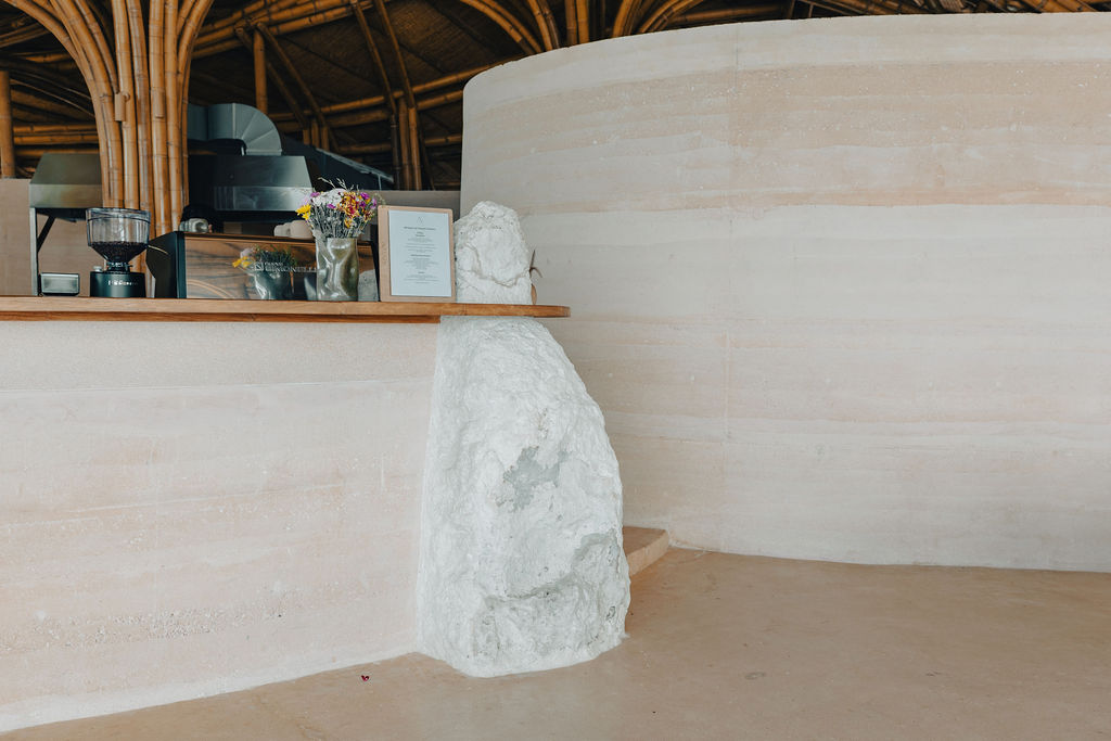 Rammed earth wall showcasing sustainable building materials at a retreat in Bali.