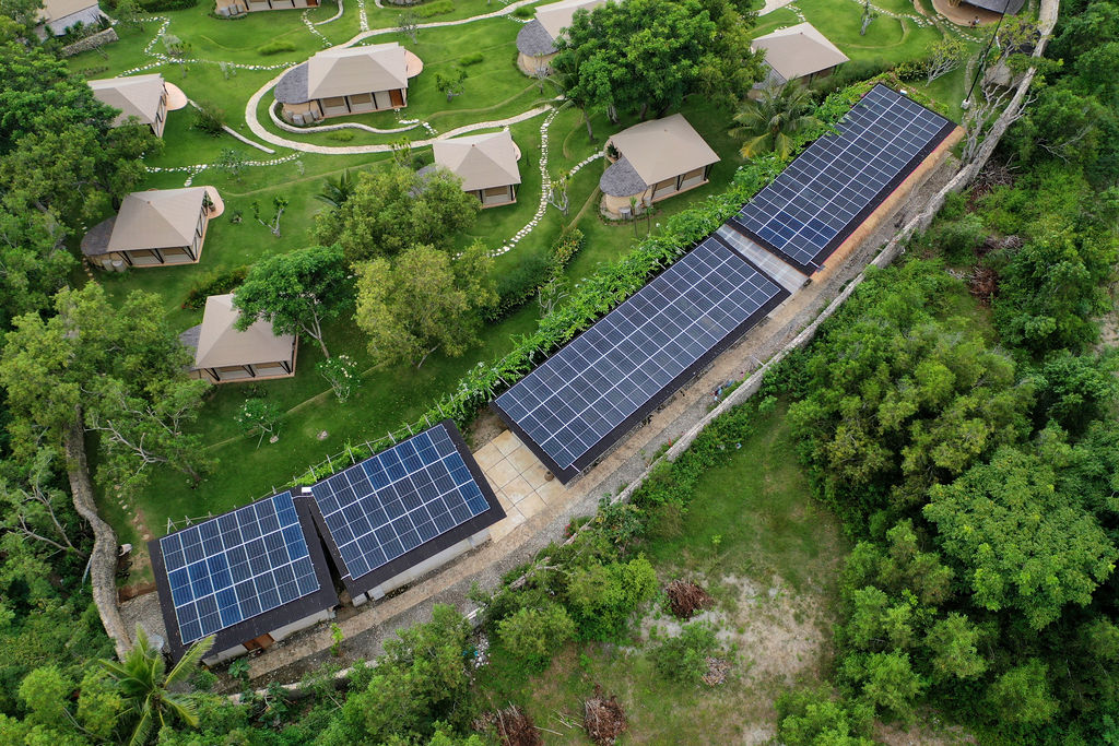 Solar panels powering a sustainable luxury retreat in Bali.