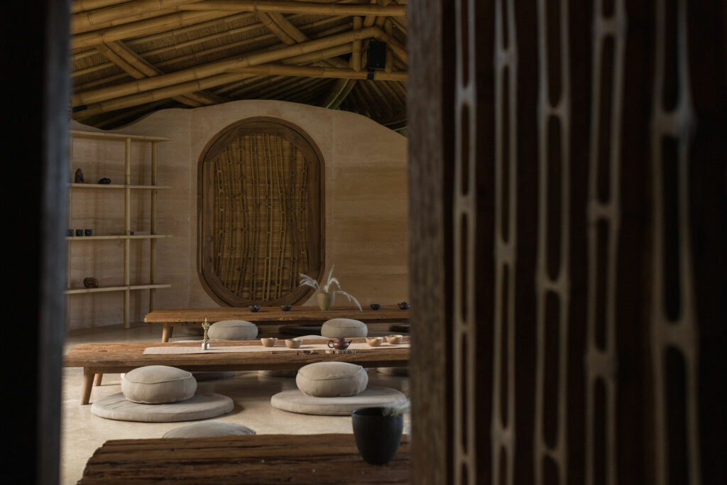 A serene bamboo doorway leads into the retreat's tea ceremony room.