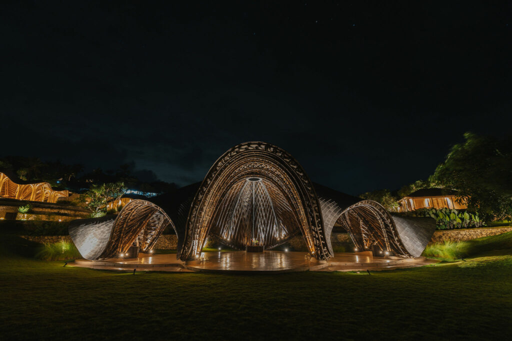 Illuminated yoga shala at night at a luxury retreat in Bali.