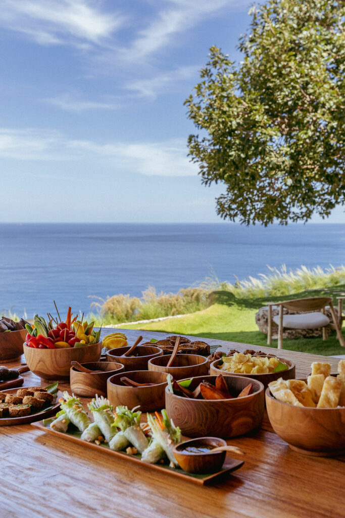 Farm-to-table dining spread with ocean views in Bali.