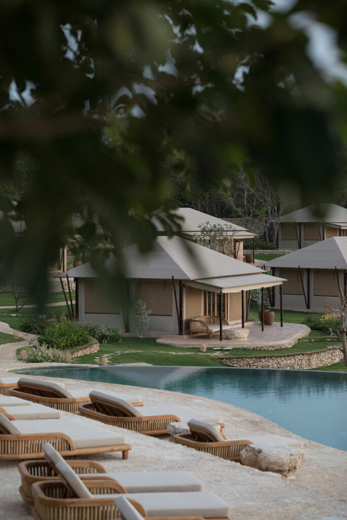 Retreat grounds with tent suites and ocean views in Bali.